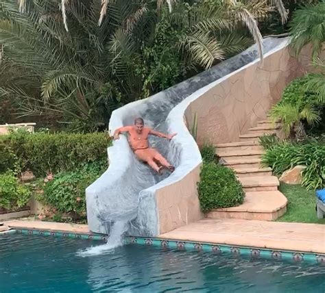 Hunter Biden goes down slide naked during pool party with woman